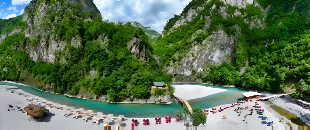Hidden Gems of Albania: Destinations Best Explored by Car 2 Scenic view of Shala River, one of hidden gems of Albania surrounded by lush mountains and turquoise waters, perfect for a car trip adventure.